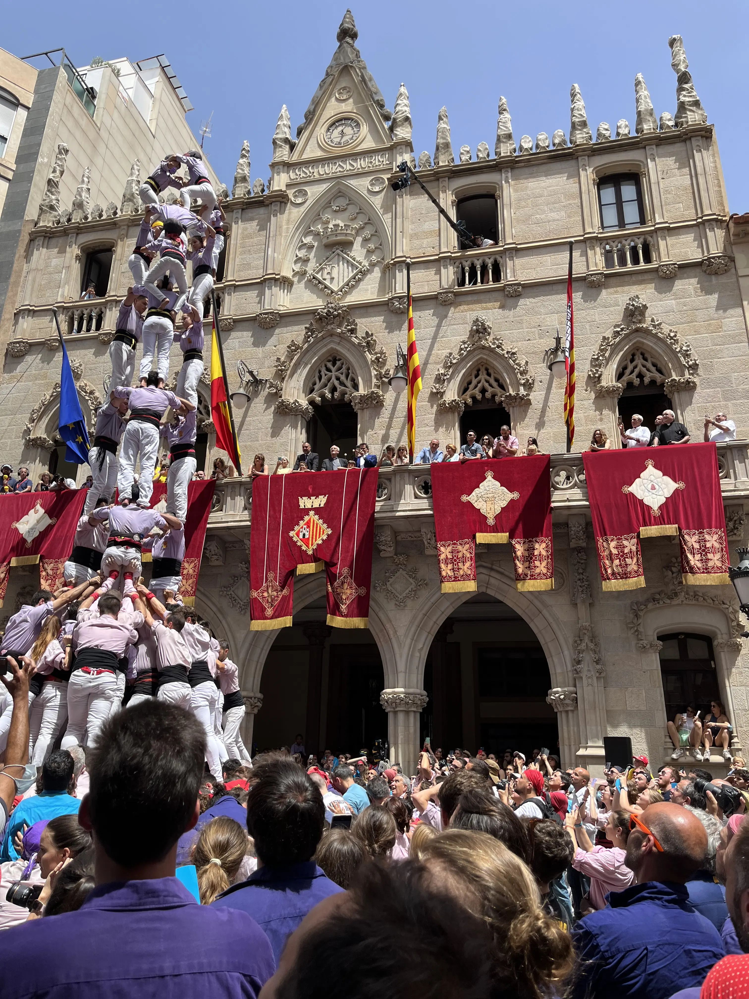 A &lsquo;castell&rsquo; (human tower) being built during a festival in Spain